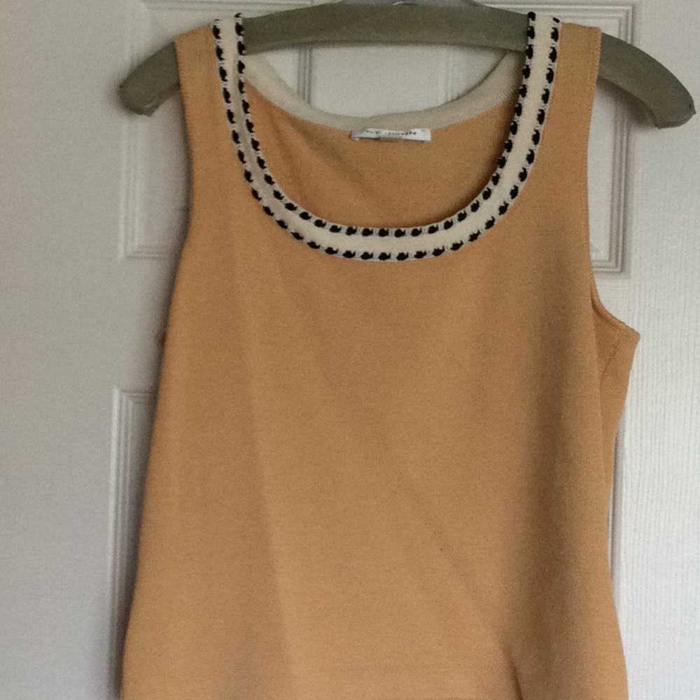 Three piece skirt, tank and jacket set.